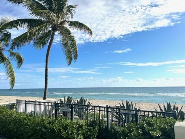 property view of water featuring a beach view