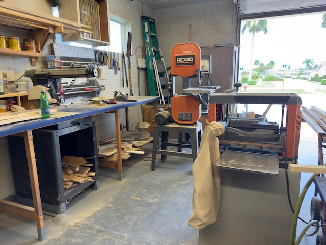 interior space featuring a workshop area and unfinished concrete floors