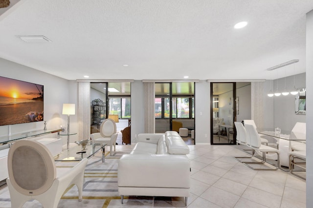 tiled living room with a textured ceiling