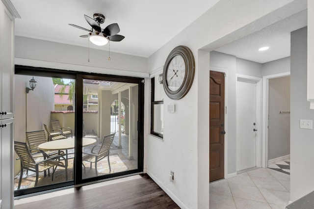 interior space featuring light hardwood / wood-style floors and ceiling fan