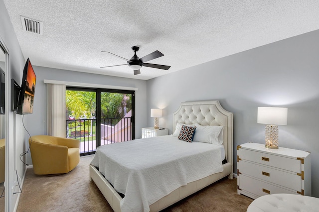 bedroom featuring access to exterior, a textured ceiling, carpet floors, and ceiling fan