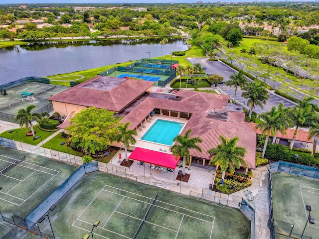 birds eye view of property with a water view