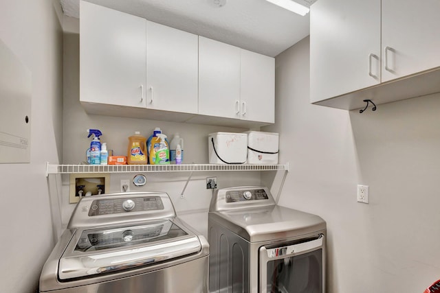 laundry area with cabinets and separate washer and dryer