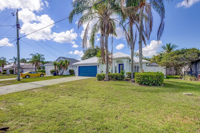 view of front of home featuring a front yard and a garage