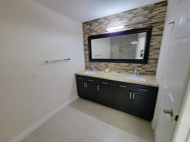 bathroom with vanity, backsplash, and tile patterned floors