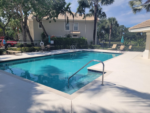 view of swimming pool with a patio