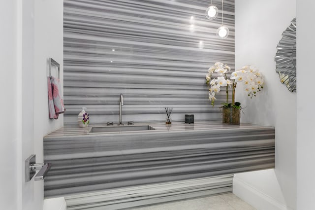 bathroom with tile floors and sink