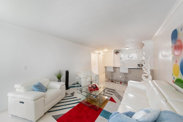 tiled living room featuring ornamental molding