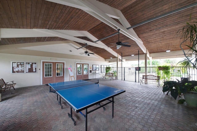 recreation room featuring french doors, wood ceiling, carpet floors, and lofted ceiling with beams