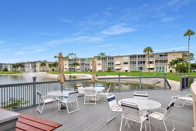 wooden deck featuring a water view