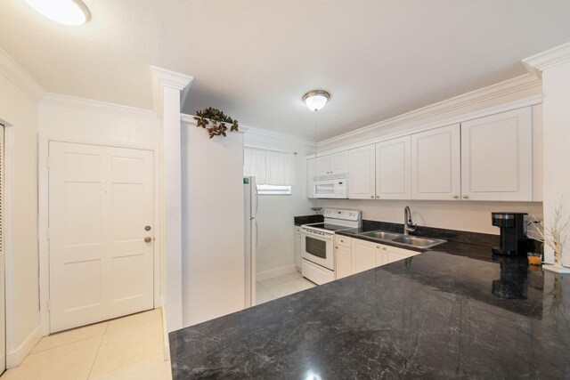 kitchen featuring white cabinets, sink, white appliances, and crown molding