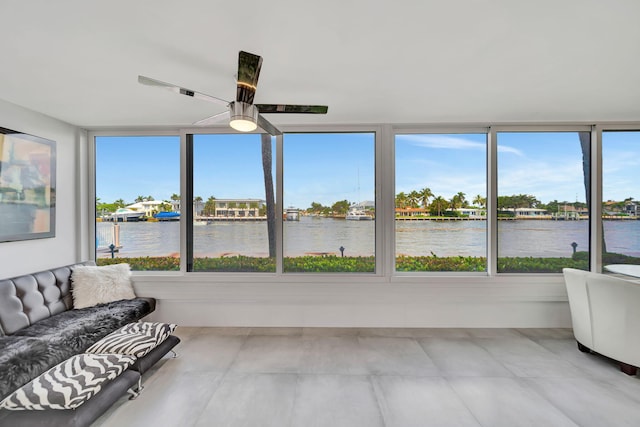 sunroom with a water view and plenty of natural light