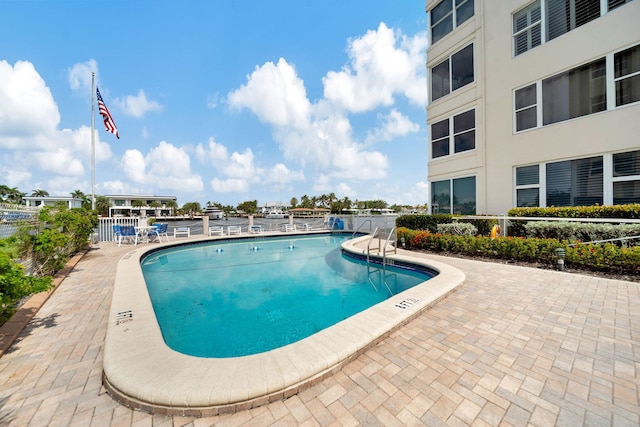 view of swimming pool with a patio