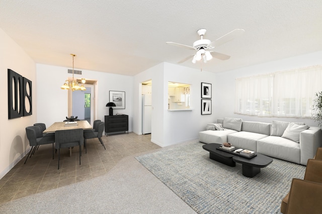 118 Kingswood F Unit 118, West Palm Beach, FL 33417 - living room featuring a chandelier, baseboards, and a ceiling fan
