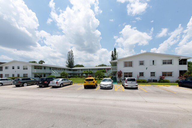 118 Kingswood F Unit 118, West Palm Beach, FL 33417 - view of property with uncovered parking