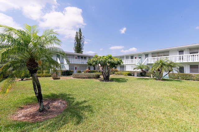 118 Kingswood F Unit 118, West Palm Beach, FL 33417 - view of home's community featuring a lawn