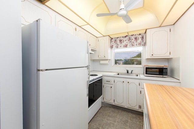 kitchen featuring white cabinets, ceiling fan, white appliances, and sink