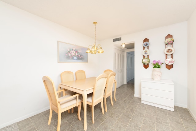 dining space featuring a chandelier