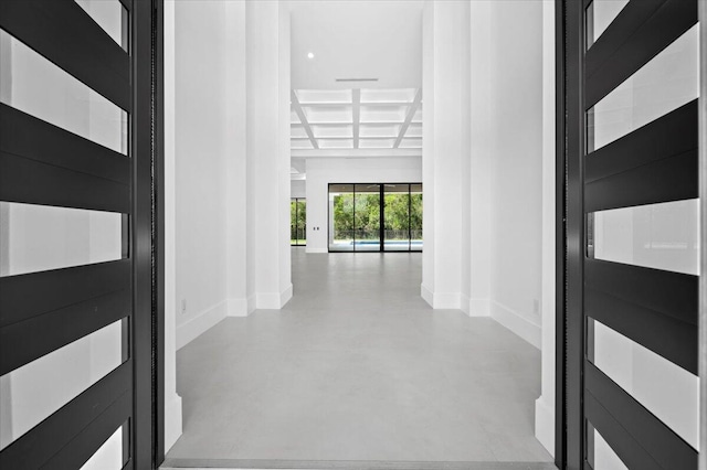 corridor with beam ceiling and coffered ceiling