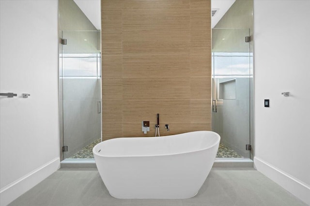 bathroom featuring separate shower and tub and tile patterned floors