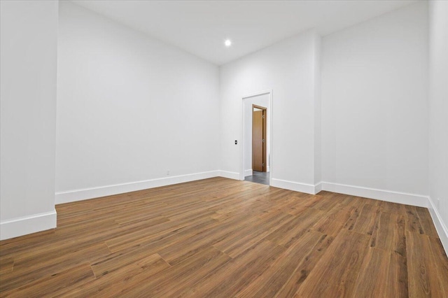 spare room with wood-type flooring