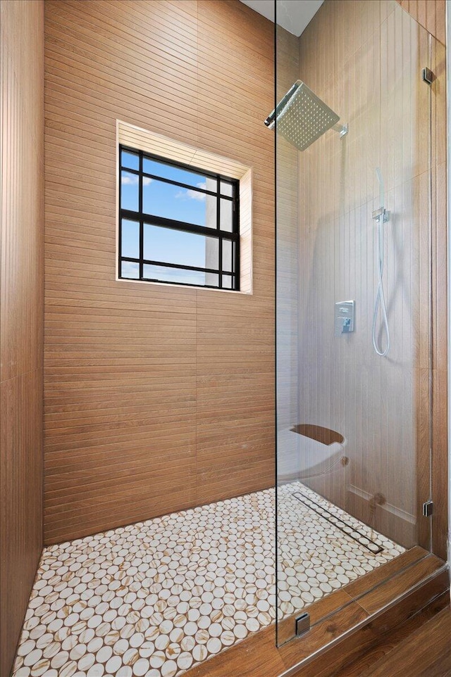 bathroom with tiled shower