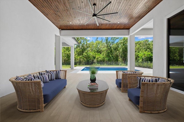 view of patio / terrace featuring ceiling fan and an outdoor living space