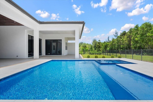 view of swimming pool with a patio