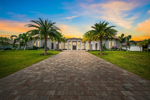 view of front of property with a lawn