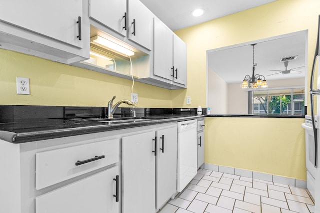 kitchen featuring ceiling fan with notable chandelier, white dishwasher, sink, pendant lighting, and white cabinets