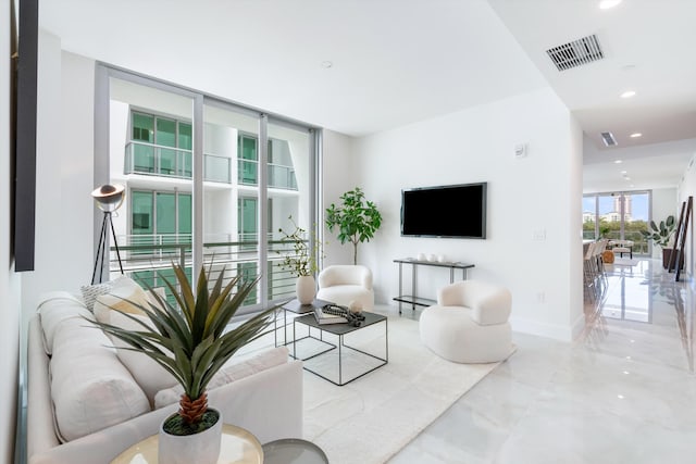 living room with floor to ceiling windows