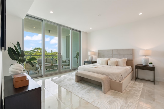 bedroom featuring access to exterior and floor to ceiling windows