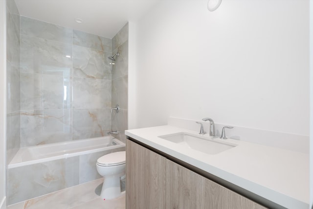 full bathroom with tile patterned floors, vanity, toilet, and tiled shower / bath combo