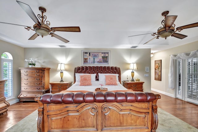 bedroom with ceiling fan and hardwood / wood-style floors