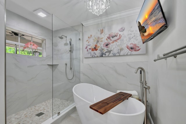 bathroom with shower with separate bathtub, ceiling fan, ornamental molding, and tile walls