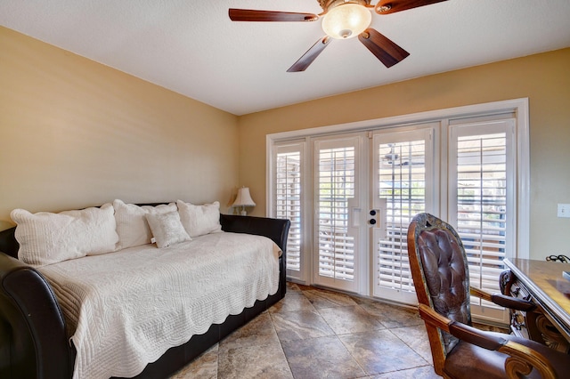 bedroom featuring ceiling fan, access to exterior, and french doors