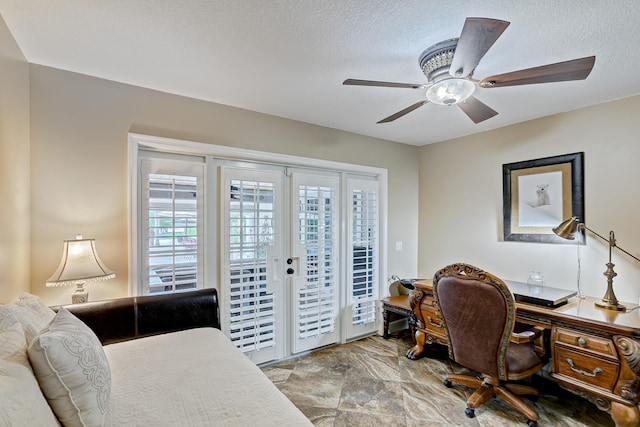 office space featuring ceiling fan, french doors, and a textured ceiling