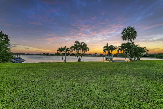 yard at dusk with a water view