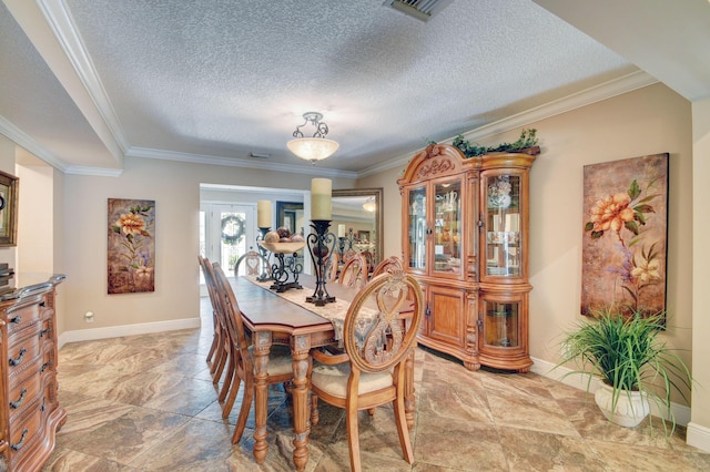 dining room featuring crown molding and a textured ceiling