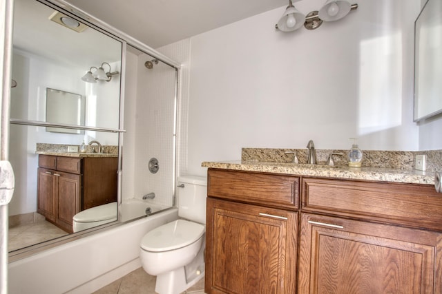 full bathroom with tile patterned flooring, vanity, toilet, and shower / bath combination with glass door