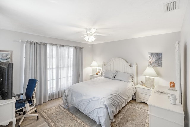 bedroom featuring ceiling fan and light hardwood / wood-style floors