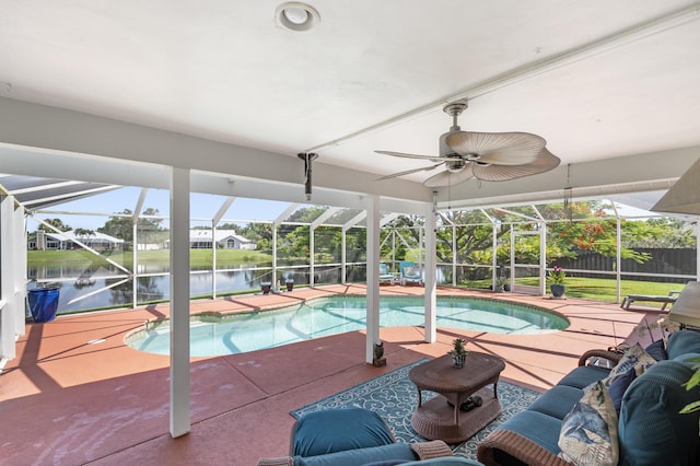 view of pool featuring a water view, a lanai, and a patio area