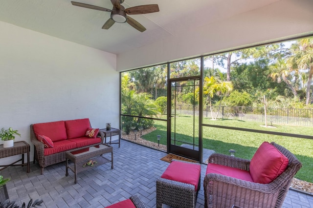 sunroom with ceiling fan