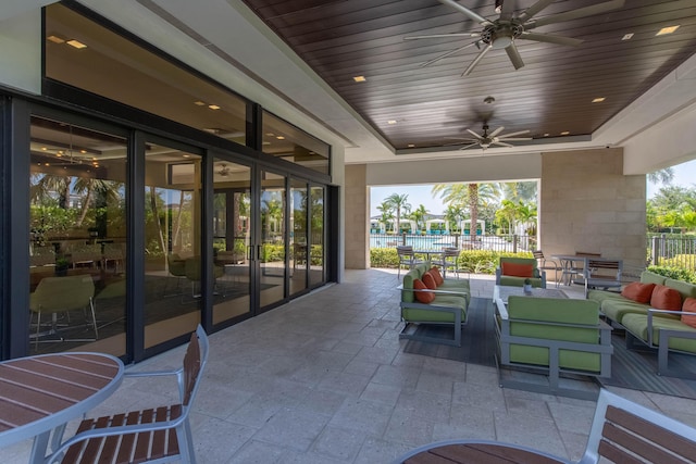 view of patio featuring an outdoor hangout area and ceiling fan