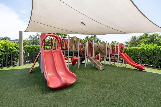 view of jungle gym with a lawn