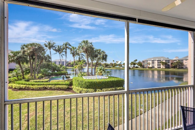 unfurnished sunroom featuring a water view