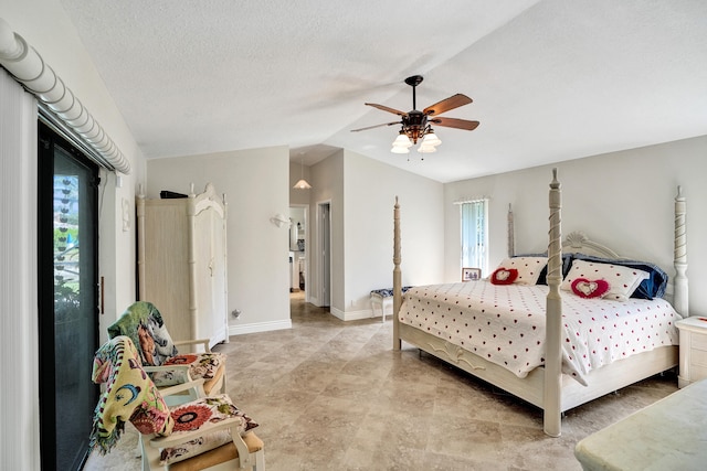 bedroom with ceiling fan, lofted ceiling, a textured ceiling, and multiple windows