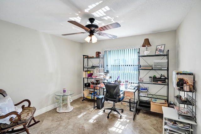 office with ceiling fan and a textured ceiling