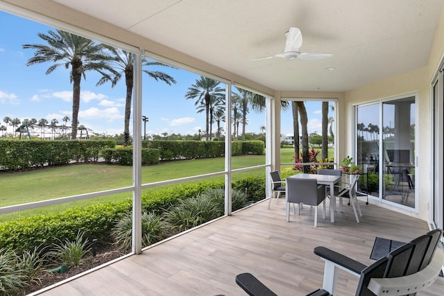 sunroom / solarium with ceiling fan