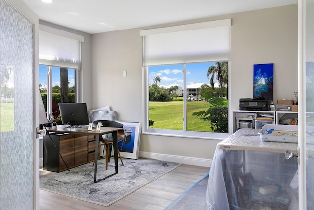 office area with light hardwood / wood-style floors